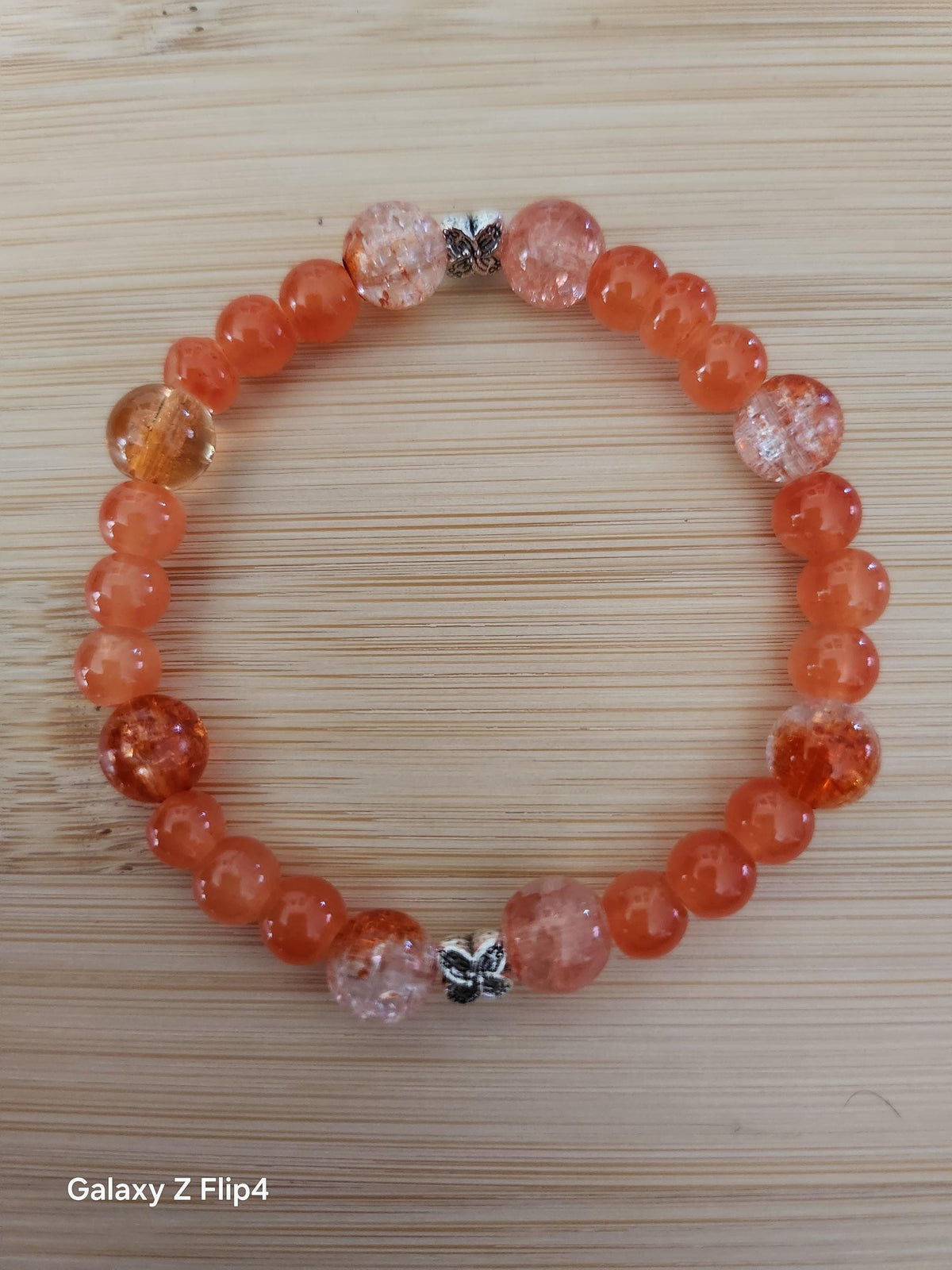 Bracelet fantaisie Solaris, perles orangées sur fil élastique 15 cm