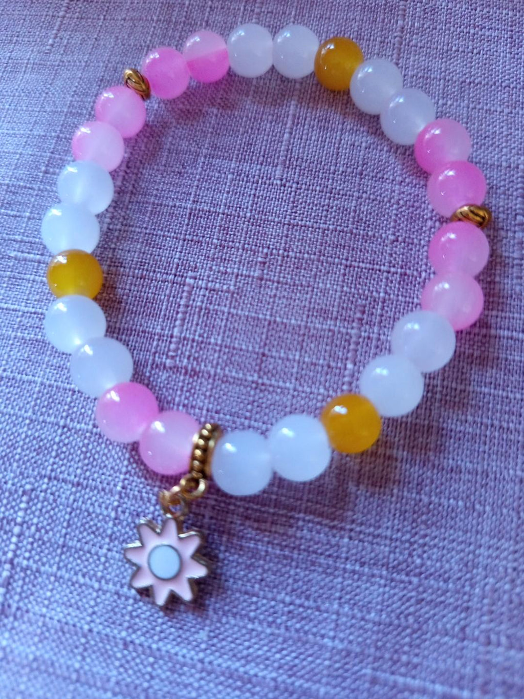 Bracelet fantaisie en perles roses - Octobre Rose = Fleur de Soleil