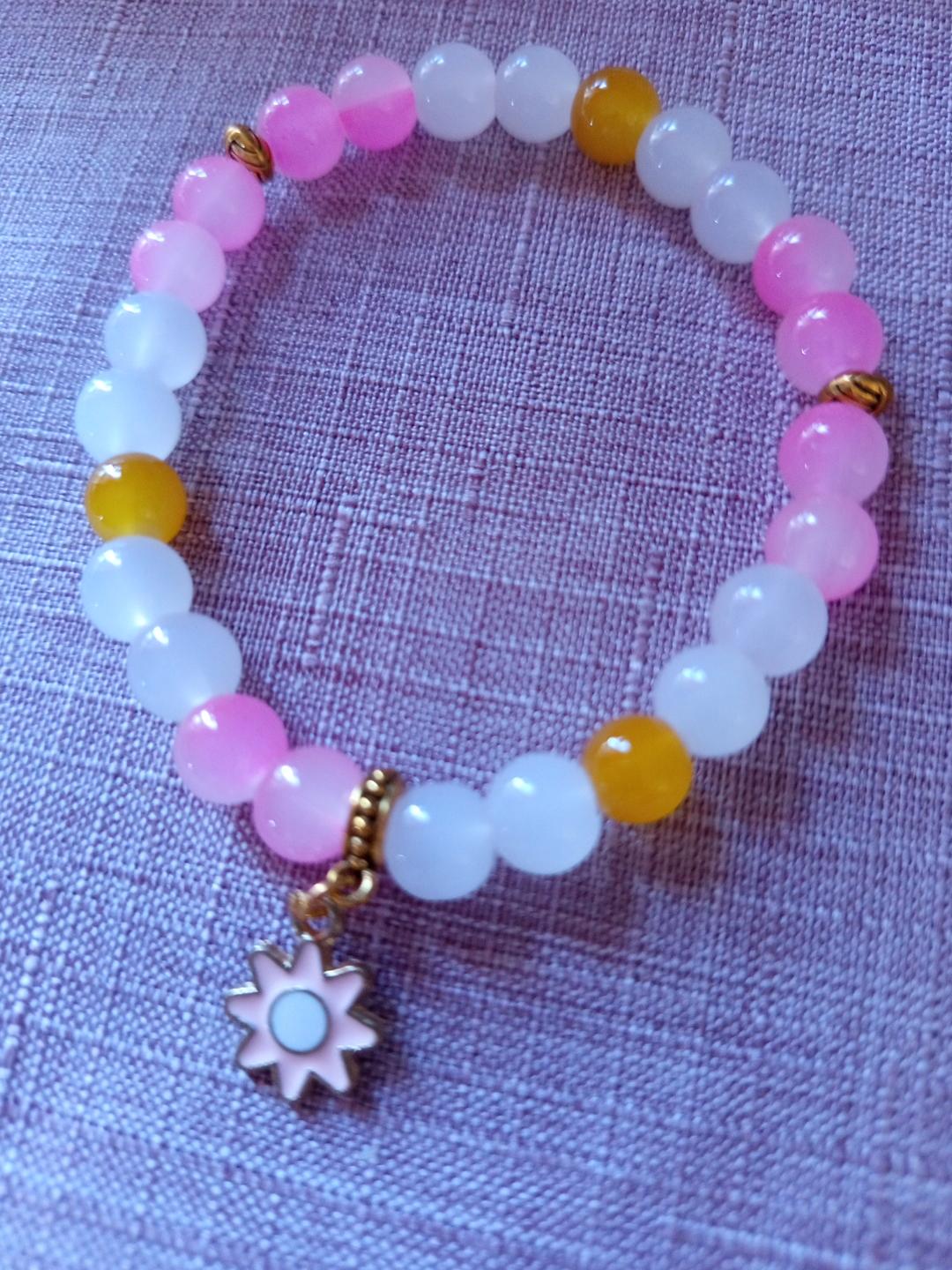 Bracelet fantaisie en perles roses - Octobre Rose = Fleur de Soleil