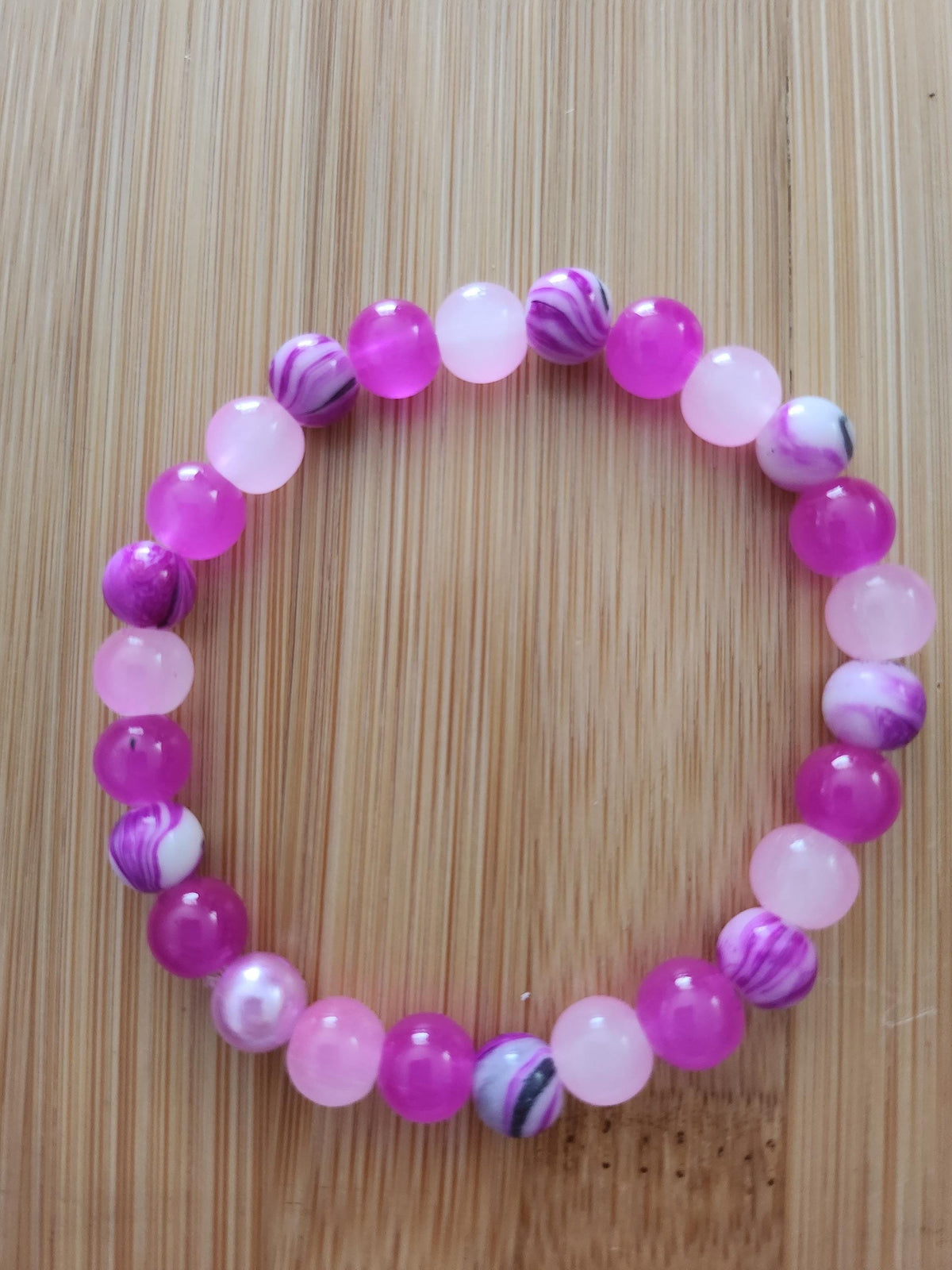 Bracelet fantaisie en perles rouges & roses marbrées - Framboisine -