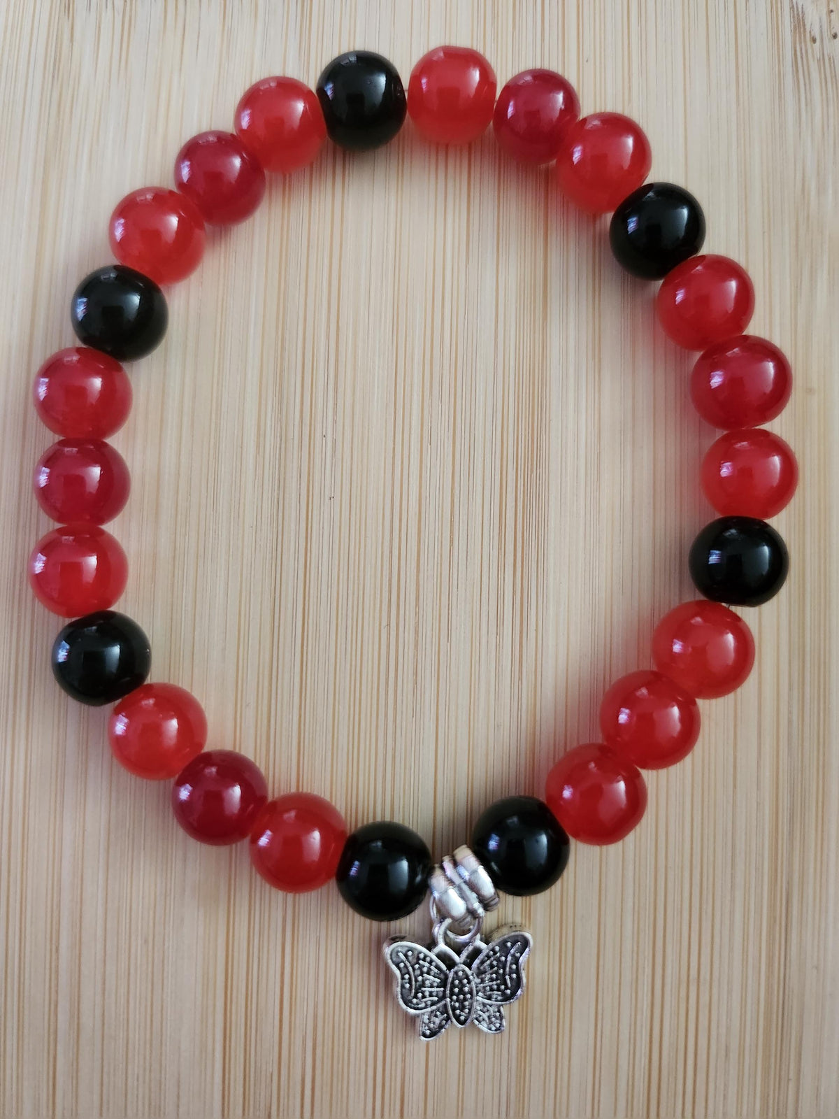 Ensemble Stylo & Bracelet en perles fantaisie  Rouges et Noires, Papillon Argenté - Coque-Licot,