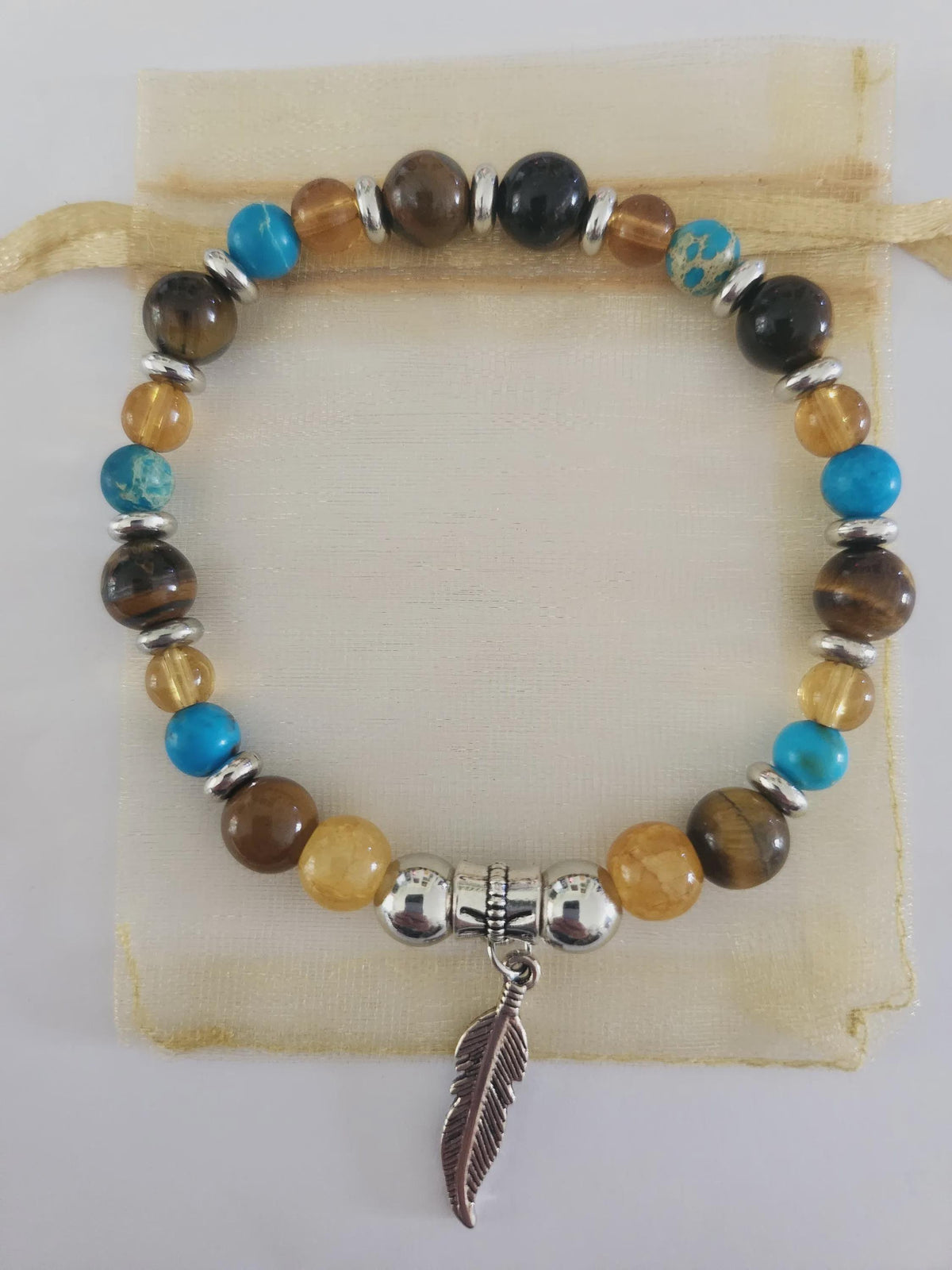 Bracelet fantaisie en perles Turquoise et Pendentif plume - gardien du ciel -
