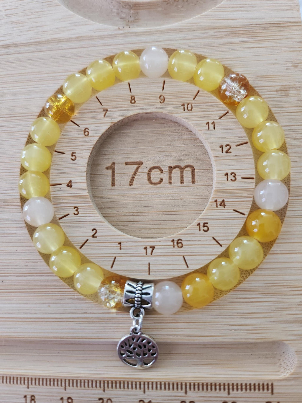 Bracelet en perles jaunes translucides, breloque Arbre de Vie et détails argentés