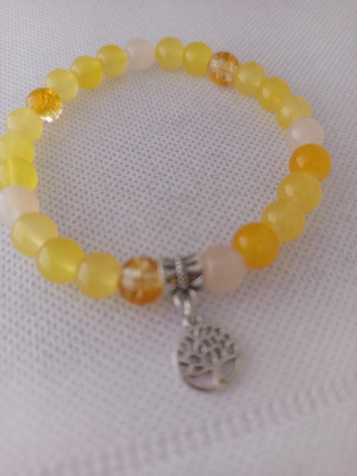 Bracelet en perles jaunes translucides, breloque Arbre de Vie et détails argentés