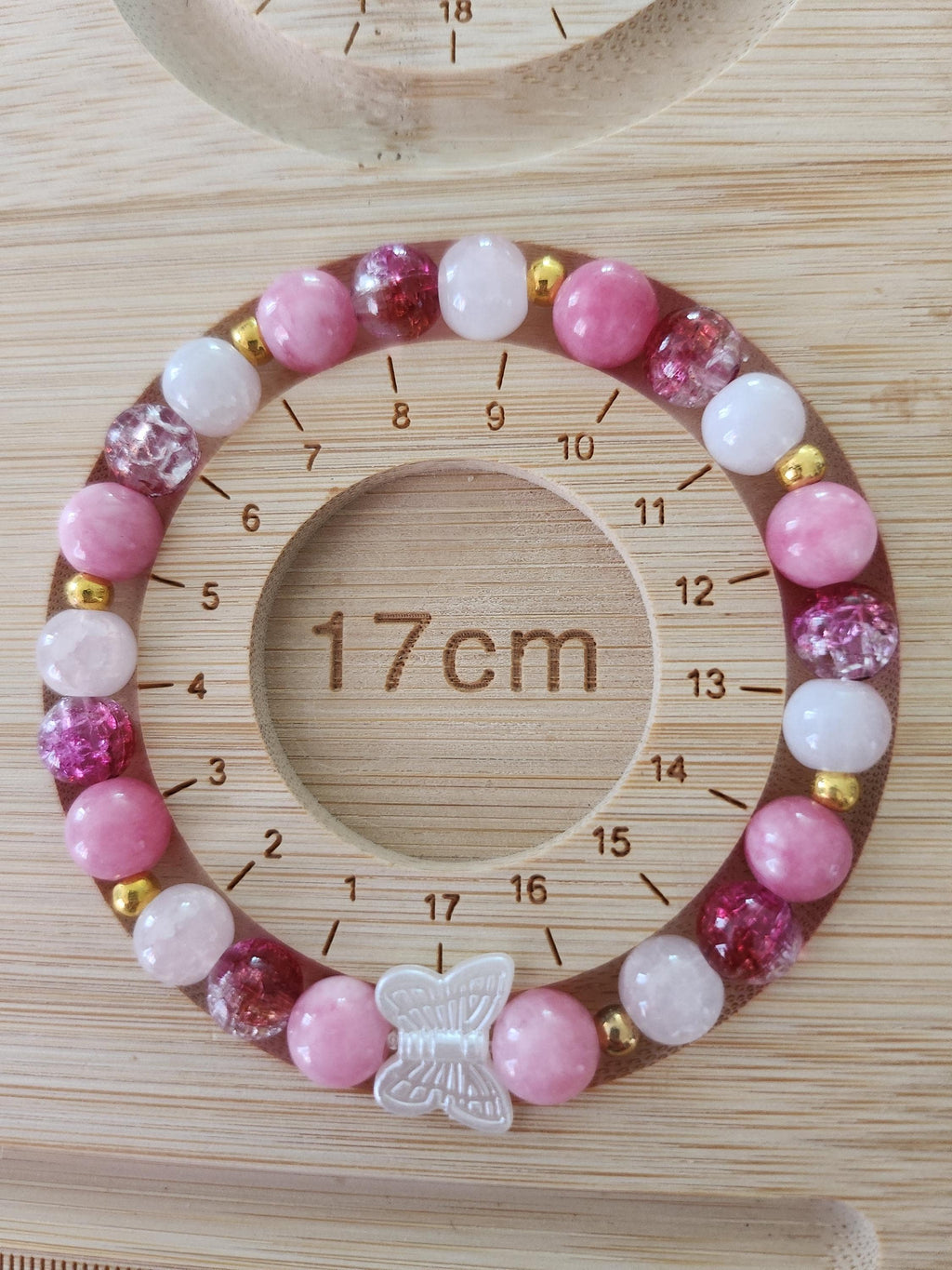 Bracelet fantaisie en  Perles Roses et Papillon Central - Œillet -