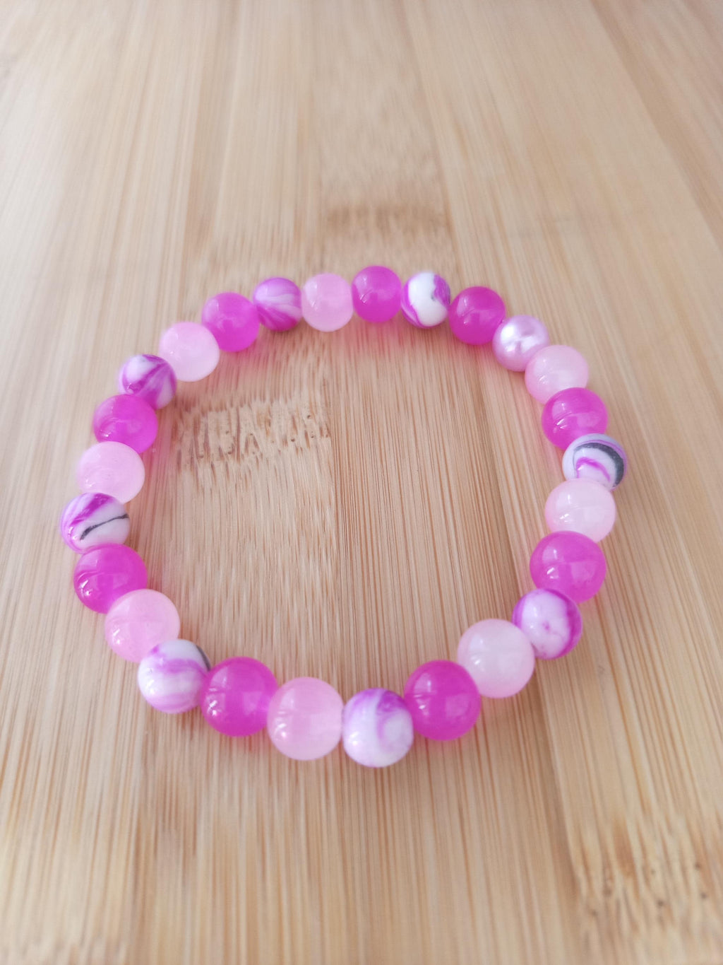 Bracelet fantaisie en perles rouges & roses marbrées - Framboisine -