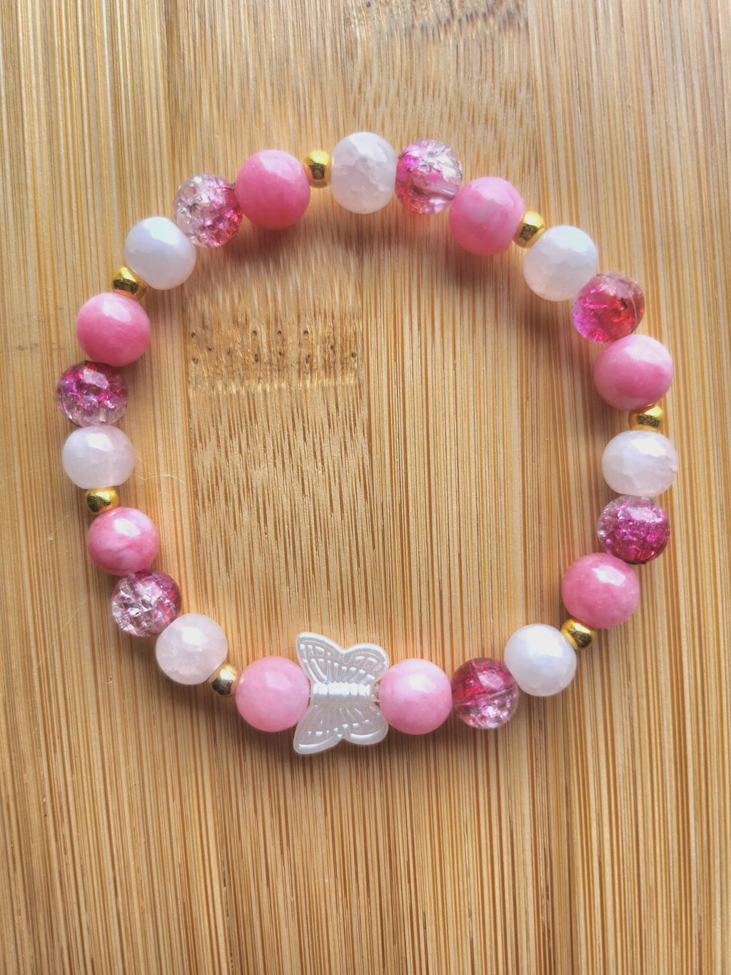 Bracelet fantaisie en  Perles Roses et Papillon Central - Œillet -