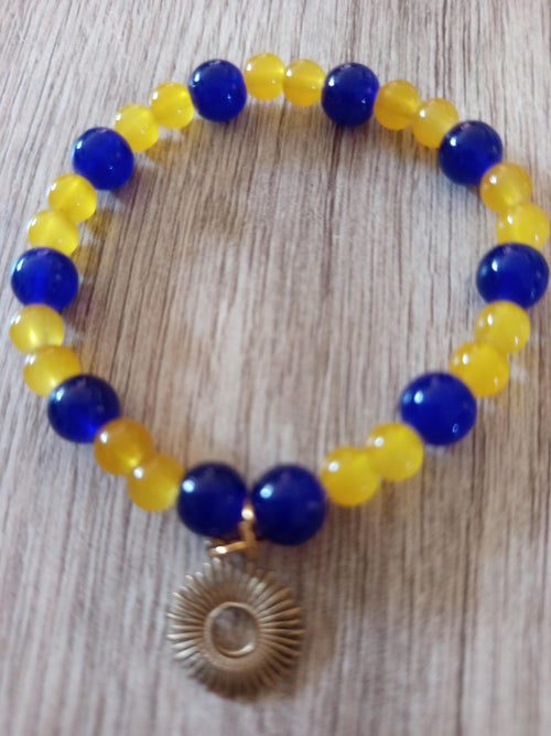 Bracelet artisanal Solis, perles bleues et jaunes, breloque soleil
